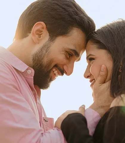 A sun-kissed, joyful portrait where their smiles say everything. We aim to capture the light in your eyes when you look at each other.