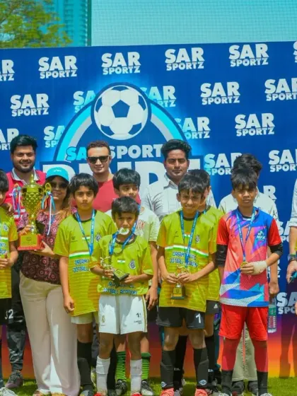 A winning team poses with their coaches and me after the Pride Cup final.