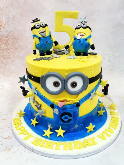 We turn up the fun with this 3D Minions cake, designed to look like one of the mischievous characters. Topped with two more playful Minions, this bright yellow cake is full of personality and is a fantastic, immersive centerpiece for a themed birthday party.
