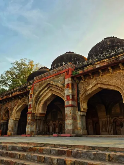 The beautiful arches of a monument in Lodi Garden, captured during the golden hour. The play of light and shadow highlights the intricate details of the architecture.