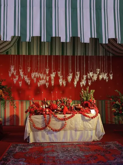 The full view of our 'Ode to India' table design exhibition, with striped tented fabric creating a majestic, old-world Indian vibe.