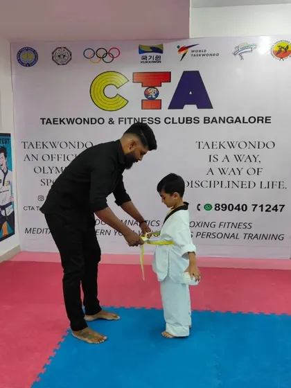 Tying a yellow belt.