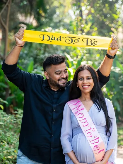 Celebrating their new roles with "Mom to Be" and "Dad to Be" sashes. This is a fun and popular way to add a celebratory element to any maternity photoshoot.