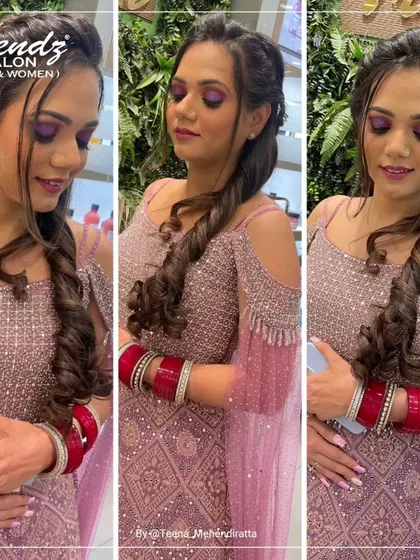 For this look, we chose a vibrant purple eyeshadow to make a statement. Paired with a twisted braid hairstyle, it's a modern and chic choice for a sangeet or engagement party.