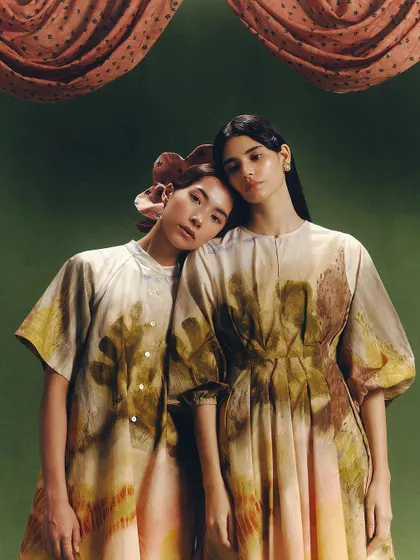 Models showcasing pieces from Cord's "SUMMER'24" collection. The artistic direction, featuring a custom green backdrop and draped fabric, reflects the brand's conscious and handmade aesthetic.