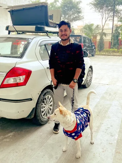 Bubble, an Indie dog, with his handler after a comfortable road journey. We provide safe and reliable interstate pet transport services by road.