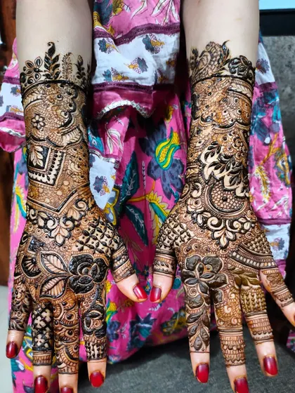 A detailed, full-coverage design perfect for a bride or any grand occasion. The mix of floral and geometric patterns is simply stunning.
