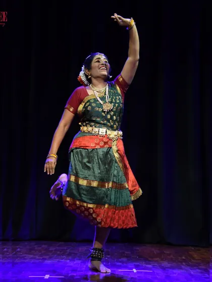 A student from our adult Bharatanatyam batch, completely in her element on stage. Her happiness and dedication are what make our community so special.
