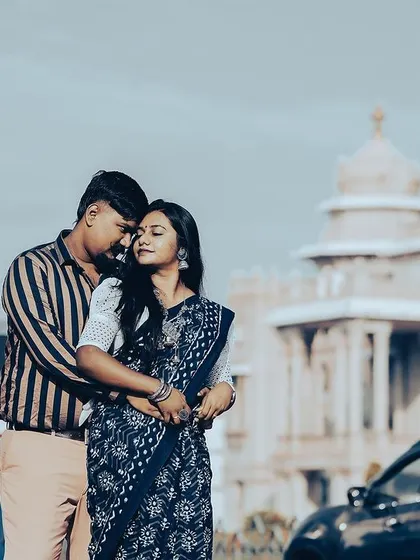 A duplicate of a romantic pre-wedding photo with the Vidhana Soudha in the background.