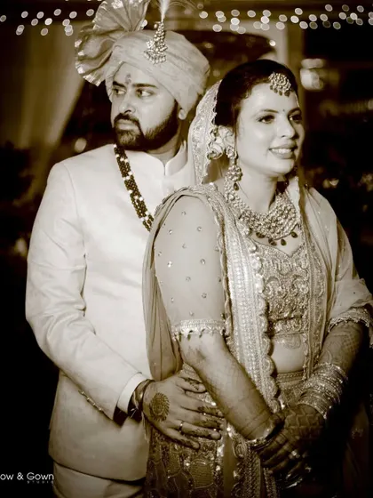 A sepia-toned wedding portrait that gives the photo a vintage, classic feel. The couple looks elegant and happy in this timeless shot.