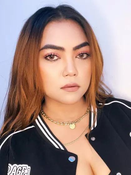 A casual and cool portrait in a varsity jacket.