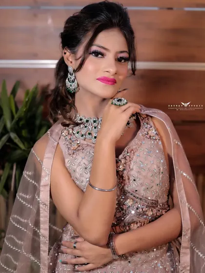 A confident and poised portrait. The bride's hand rests on her arm, creating a strong and elegant pose that showcases her modern jewellery.