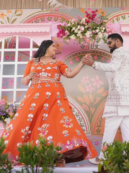 The Mehandi ceremony should be full of life and color. I designed this vibrant, carnival-themed backdrop with whimsical patterns and bright florals, creating a joyful stage for Amoolya and Vaibhav to dance and celebrate.