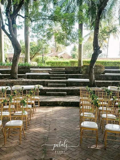 The elegant Tiffany chairs are arranged in the beautiful courtyard of Angana, ready for the wedding ceremony.