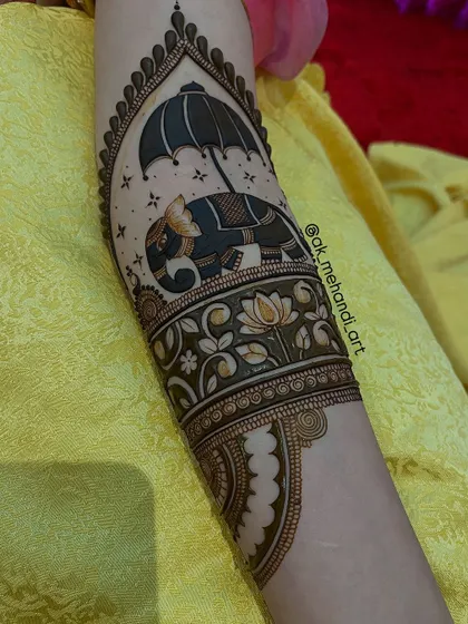 This design incorporates the elephant motif into a larger, more complex arm piece, showing how versatile these figures can be.