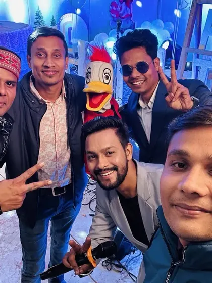 A group selfie with Ducky and the event team after a successful show. Ducky loves posing for pictures.