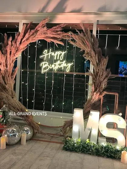 Another angle of the pampas grass setup, showing different marquee initials ('MS') to demonstrate how I customize the decor for each client.