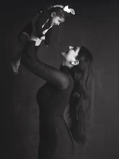 The powerful connection between a mother and her child, captured in a timeless black and white portrait. These sessions focus on emotion and the simple, profound beauty of your bond.