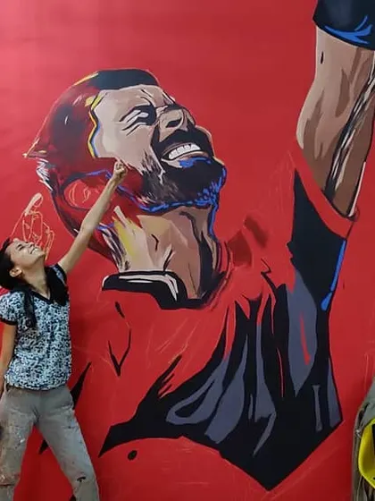A fun behind the scenes moment from the RCB mural project. We always have a great time bringing these huge pieces to life.