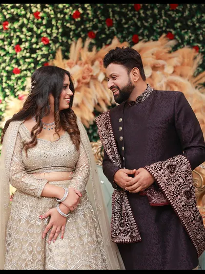 A candid shot of the couple sharing a look during their engagement ceremony. We are always ready to capture these unscripted interactions against the backdrop of the event decor.