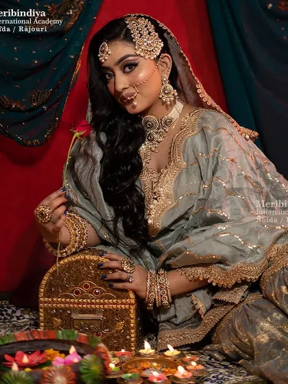 The full setting for a Pakistani bride, where the hairstyle is designed to be both glamorous and hold traditional jewelry in place.