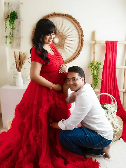 A tender moment with the father-to-be listening to the baby bump. This is a classic and heartwarming shot for any maternity session.