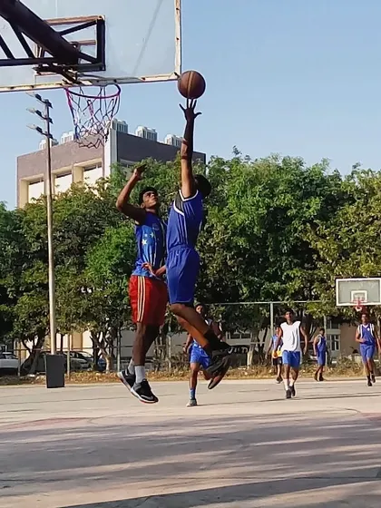 Blocking a shot at its peak. Timing and vertical leap are skills we develop through specific athletic training drills.