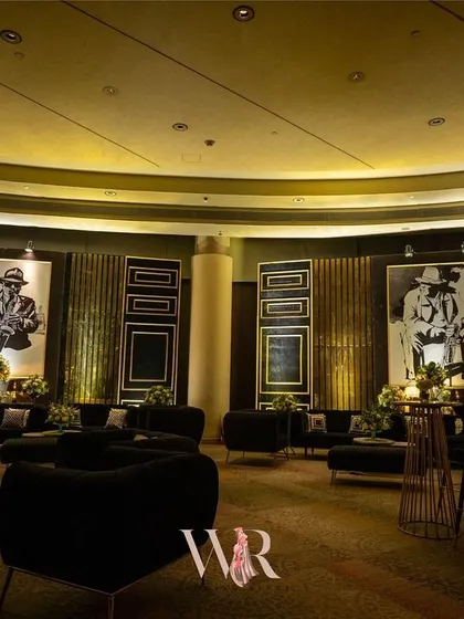 We transformed this ballroom into a sophisticated Jazz Club for a cocktail night. The design featured lounge areas with black velvet seating, large-scale portraits of jazz legends, and warm, ambient lighting to create a cool, speakeasy vibe.