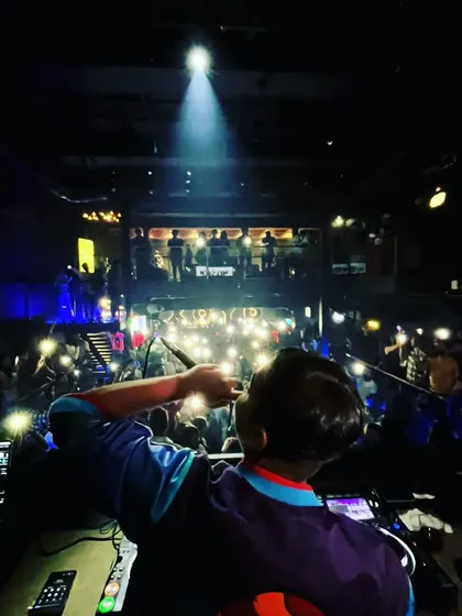 Another perspective of the flashlight moment, showing my interaction with the crowd from behind the console.
