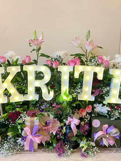 Another example of my personalized birthday creations. This one, for 'Kriti', uses a similar lush floral base but with a different color palette, showing how I can tailor each creation to the individual.
