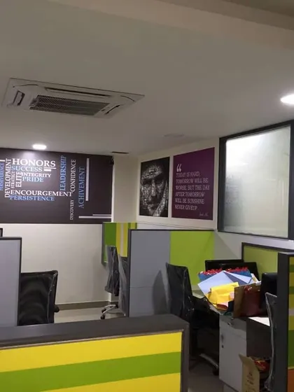 A close-up of the cubicle design and wall art at Tertium Technology.