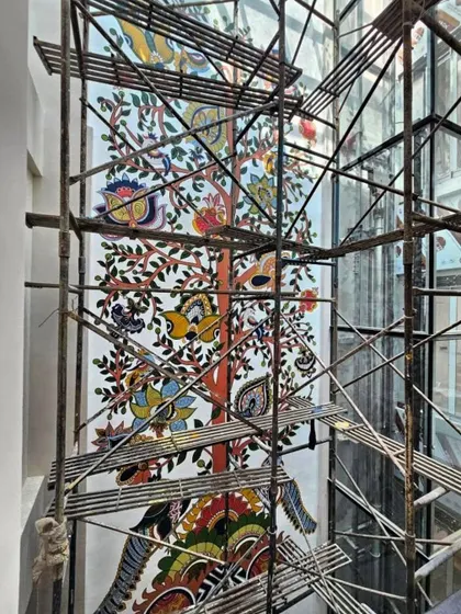 The sheer height of this residential Kalamkari mural required extensive scaffolding. It's a challenge I absolutely live for, climbing high to bring heritage art to life.