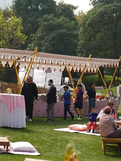 Guests mingling and enjoying the food at our outdoor picnic event. Our layouts are designed to encourage flow and interaction in a relaxed setting.