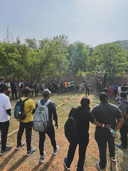 Our trek leader briefing a large corporate group at the base of the trail. Clear communication and professional guidance are key to a successful outing.