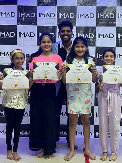 Students receiving their certificates after the 2023 annual showcase.