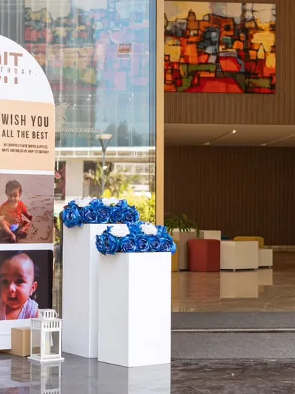 A personalized welcome board for a first birthday, featuring a photo collage of the baby's first year. It's a beautiful and sentimental way to greet guests.