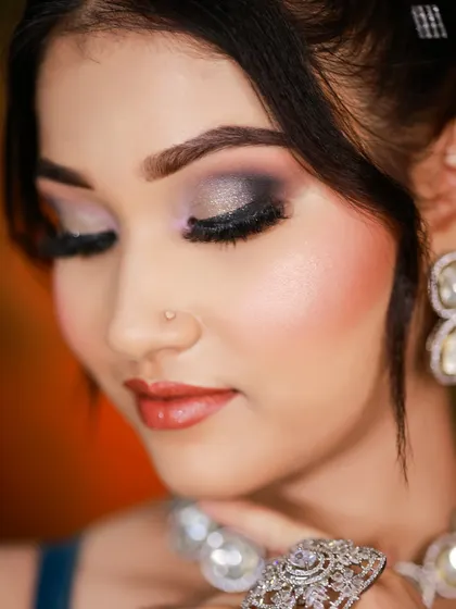 This shot focuses on the metallic smokey eye, a technique we teach for creating dramatic and alluring party looks.