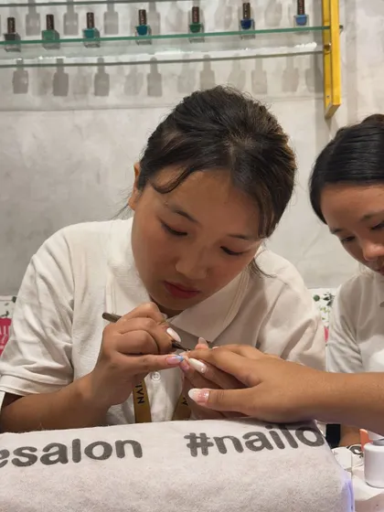 Another shot of our nail artist meticulously working on a client's nails during our event.