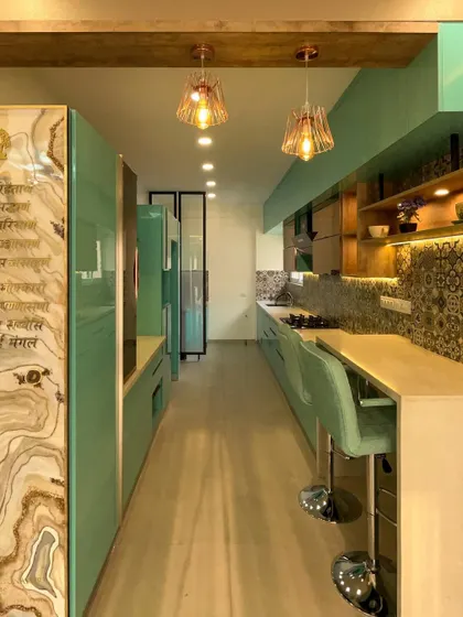 For this modular kitchen, we used our in-house factory to produce vibrant, high-gloss PU-finished cabinets. The execution included installing the patterned tile backsplash, quartz countertops, and integrated breakfast bar, all while ensuring perfect alignment and functionality with Hettich hardware.