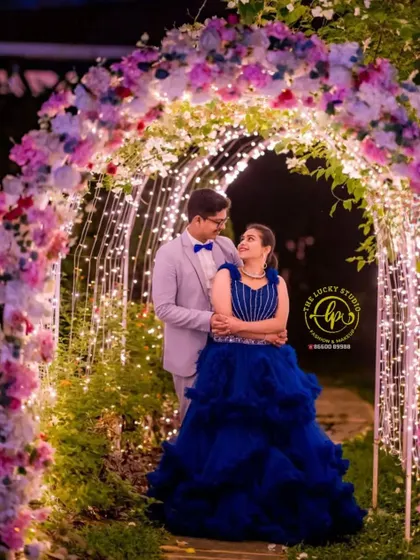 A magical night-time shot under a floral arch. My couples styling service ensures that both partners look harmonious and camera-ready for every photo.