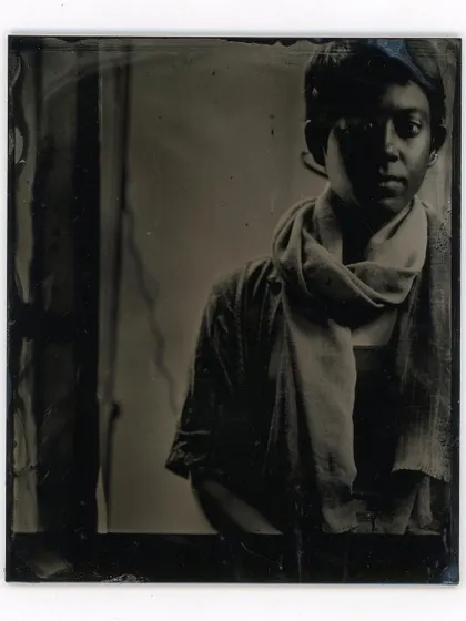 An intimate portrait using the wet plate collodion technique, where the play of light and shadow creates a timeless and soulful image.