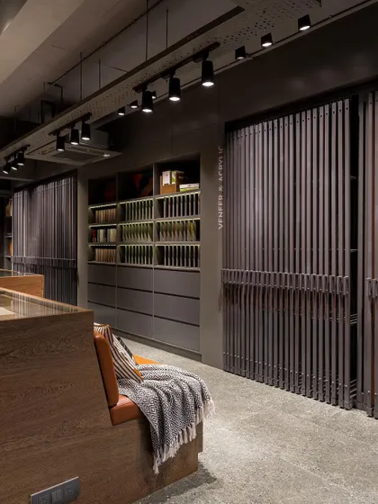 The sliding veneer display system is both a functional tool and a beautiful design element in its own right.