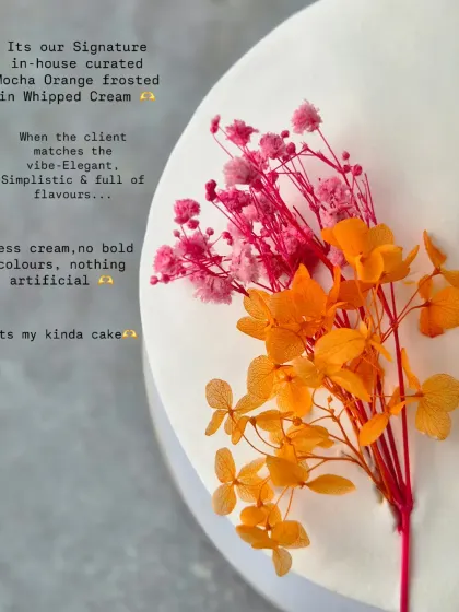 A close-up of my Mocha Orange cake, decorated with a simple sprig of dried flowers. This is my kind of cake: elegant, minimalistic, and full of flavour.