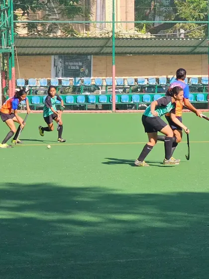 Our players work together to advance the ball during the semi-final match. Coordinated team play is the foundation of our strategy.