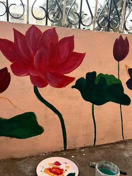 The painting process is underway. I've started blocking in the main colours for the lotus flowers and leaves, bringing the initial sketch to life with vibrant acrylics.