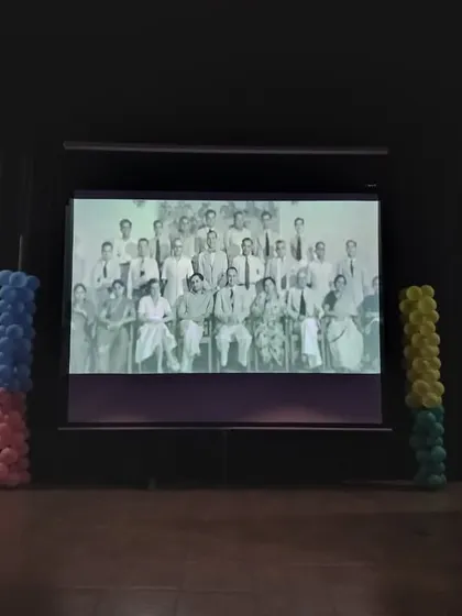 A historical photograph of India's pioneering scientists is displayed on screen, honoring their contributions during our National Space Day assembly.
