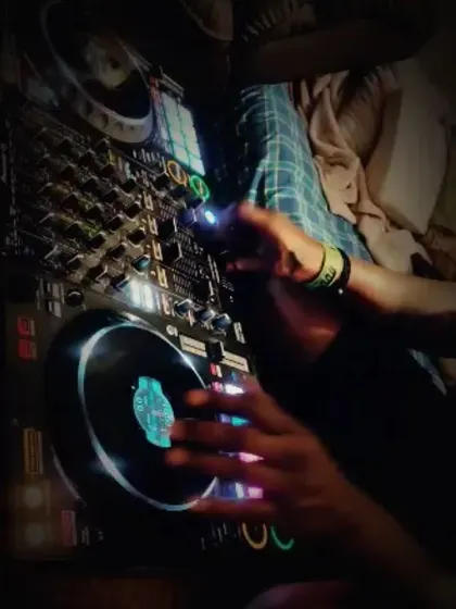 A close-up of my hands on the decks. This is where all the work happens.