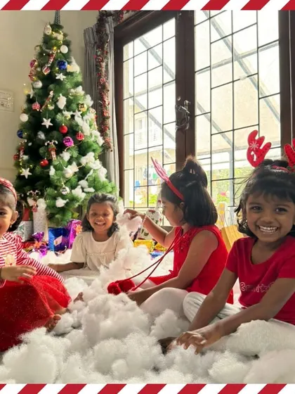 All smiles in our Christmas "snow." These happy moments of friendship and play are what make our celebrations so memorable.