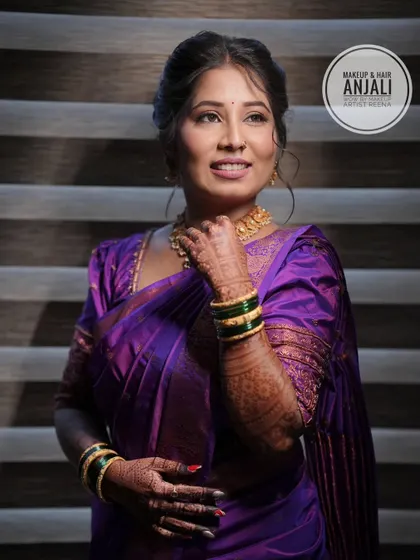 Akshaya looking serene and beautiful for her pre-wedding ceremony. The soft lighting highlights the glowing makeup look created by artist Anjali.