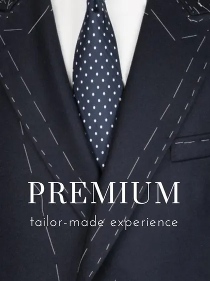 The phrase 'premium tailor-made experience' overlaid on a suit-in-progress. This image communicates my promise of expert craftsmanship and a personalized journey for every client.